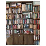 Divided bookshelf with folding doors at bottom, 11 shelves, 42”w x 9.5”d x 92”h, excludes all contents