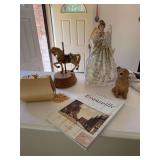 Angel figure, carousel horse figure, Evansville postcard history book, golden retriever figure