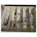 Jewelry and Contents of Bottom Drawer of Cabinet