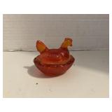 Small Amberina Chicken on a Nest
