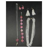 Two silver tone necklace and earring sets