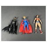 Super Girl, Bat Girl, and Wonder Woman Figures