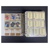 Binder of baseball and football cards