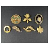 7 Gold tone floral brooches