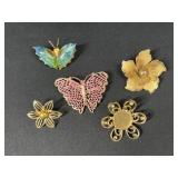Butterfly and flower brooches