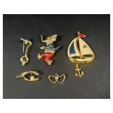 Gold tone brooches