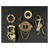 Gold tone brooches
