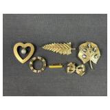 Gold tone brooches