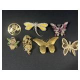Butterfly and floral brooches