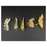 Gold tone brooches