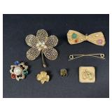 Gold tone brooches