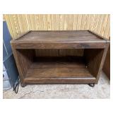 Rolling Pressboard Entertainment Center
