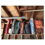 Shelf of Camping Chairs, Tent Parts, and More