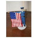 Police Woman with Flag Figurine