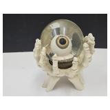 Water Globe eyeball in skelton hands 6.5 " H