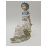 Signed Porcelain Statue Of Girl Sitting 10"