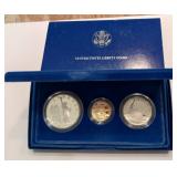 3 coin set 1986 1/4 once gold, silver dollar,  half dollar  