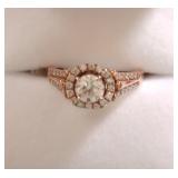 14 k rose gold 3/4 carat center diamond + .38 ctw melee 
