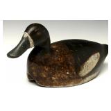 A CARVED AND PAINTED BLUEBILL HEN WORKING DECOY A CARVED AND PAINTED BLUEBILL HEN WORKING DECOY
