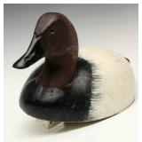 A CARVED AND PAINTED CANVASBACK DRAKE DECOY A CARVED AND PAINTED CANVASBACK DRAKE DECOY