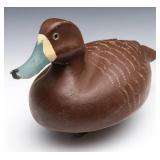 A MID TO LATE 20TH CENTURY BLUEBILL HEN WOOD DECOY A MID TO LATE 20TH CENTURY BLUEBILL HEN WOOD DECOY