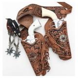 A LONE RANGER DOUBLE HOLSTER BELT, SPURS, CAP GUNS