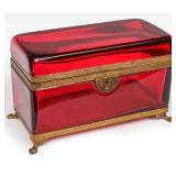 A FRENCH POLISHED RUBY GLASS AND ORMOLU CASKET