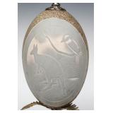 A PAIR OF CARVED EMU EGGS IN METAL MOUNTS C. 1900