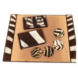 A SEVEN PIECE ZEBRA SKIN DESK SET