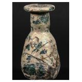 A SMALL ROMAN GLASS BOTTLE VASE