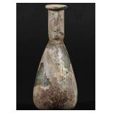 A SMALL ROMAN GLASS BOTTLE VASE