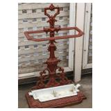 AN EARLY 20TH C. CAST IRON UMBRELLA STAND