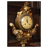 AN EARLY 20TH C CARVED AND GILT WOOD CARTLE CLOCK