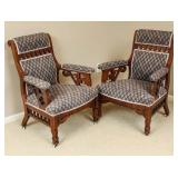 AN INTERESTING PAIR OF VICTORIAN WALNUT ARM CHAIRS