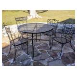 A NICE PATIO TABLE WITH TWO CHAIR PAIRS
