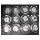 TWELVE HOYA CRYSTAL FLOWER PLATES