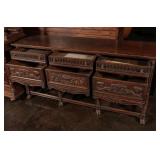 A HEAVILY CARVED OAK PAW FOOT SIDEBOARD CIRCA 1900