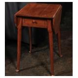 A DROP LEAF ONE DRAWER STAND TABLE