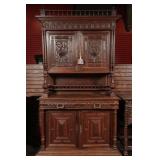 A 19TH CENTURY CONTINENTAL CARVED OAK CABINET