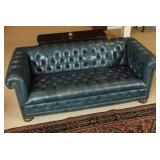 A VINTAGE BUTTON-TUCKED CHESTERFIELD SOFA