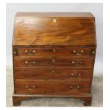 A 19TH C. AMERICAN SLANT-FRONT DESK IN MAHOGANY