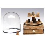 AN ANTIQUE SEWING THIMBLE STAND UNDER GLASS DOME
