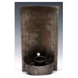 AN IRON ARTS AND CRAFTS CANDLE SCONCE