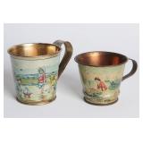 A PAIR CIRCA 1900 TIN LITHO CHILD