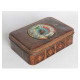 A TIN LITHO BISCUIT TIN W/ SPINNING ROULETTE GAME