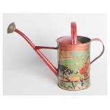 AN EMBOSSED TIN LITHO WATERING CAN