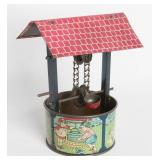 A CIRCA 1910 TIN LITHO TOY WELL, JACK & JILL VERSE