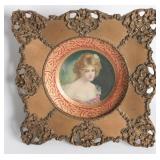 AN ORNATELY FRAMED TIN LITHO VIENNA ART PLATE