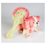 A VINTAGE CELLULOID RATTLE AND DOG FIGURE