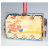 AN OHIO ART TIN LITHO CHILD